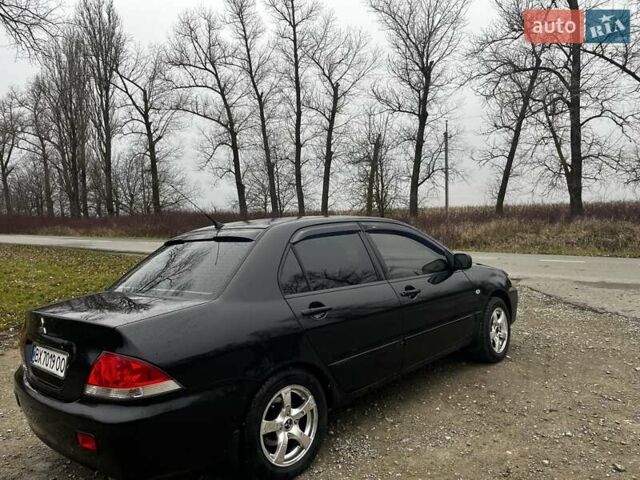 Черный Мицубиси Лансер, объемом двигателя 1.6 л и пробегом 272 тыс. км за 2800 $, фото 3 на Automoto.ua