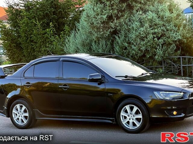 Черный Мицубиси Лансер, объемом двигателя 2 л и пробегом 216 тыс. км за 7500 $, фото 1 на Automoto.ua