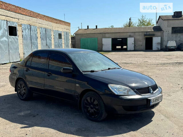 Чорний Міцубісі Lancer, об'ємом двигуна 1.6 л та пробігом 220 тис. км за 4000 $, фото 3 на Automoto.ua