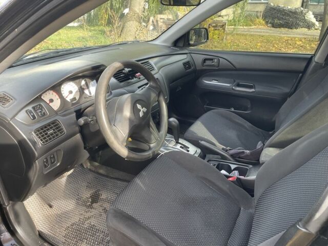 Міцубісі Lancer 2007 у Каневе на Automoto.ua Чорний Міцубісі Lancer, об'ємом двигуна 1.6 л та пробігом 310 тис. км за 4100 $, фото 12 на Automoto.ua