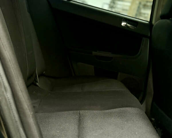 Черный Мицубиси Лансер, объемом двигателя 2 л и пробегом 215 тыс. км за 5500 $, фото 15 на Automoto.ua