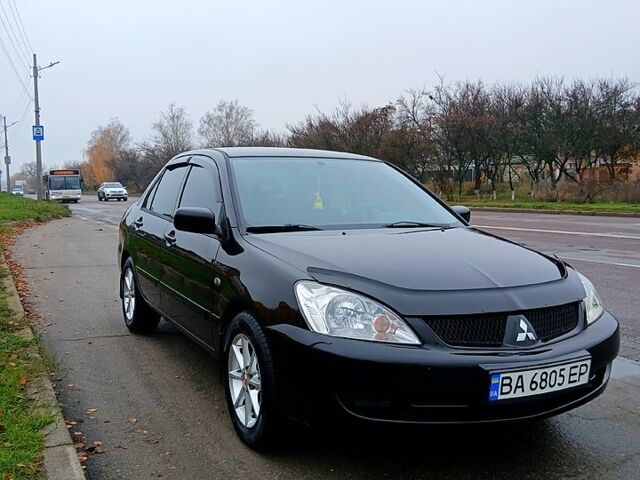 Чорний Міцубісі Lancer, об'ємом двигуна 1.6 л та пробігом 240 тис. км за 4700 $, фото 1 на Automoto.ua
