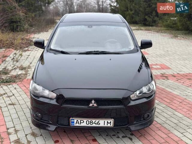 Черный Мицубиси Лансер, объемом двигателя 2 л и пробегом 217 тыс. км за 5500 $, фото 1 на Automoto.ua