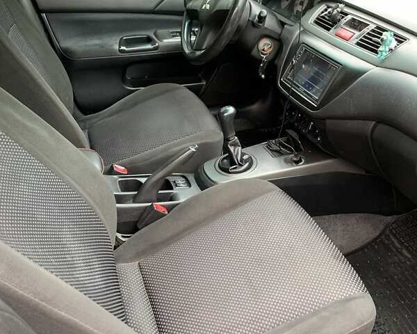 Черный Мицубиси Лансер, объемом двигателя 1.6 л и пробегом 164 тыс. км за 5200 $, фото 9 на Automoto.ua