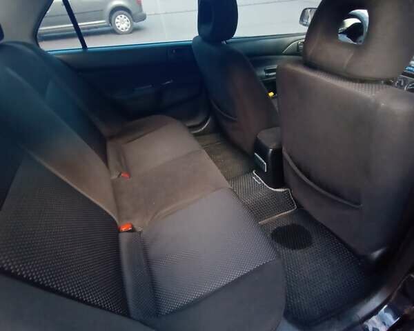 Чорний Міцубісі Lancer, об'ємом двигуна 1.6 л та пробігом 296 тис. км за 4500 $, фото 3 на Automoto.ua