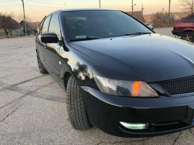 Чорний Міцубісі Lancer, об'ємом двигуна 0.16 л та пробігом 220 тис. км за 4500 $, фото 12 на Automoto.ua