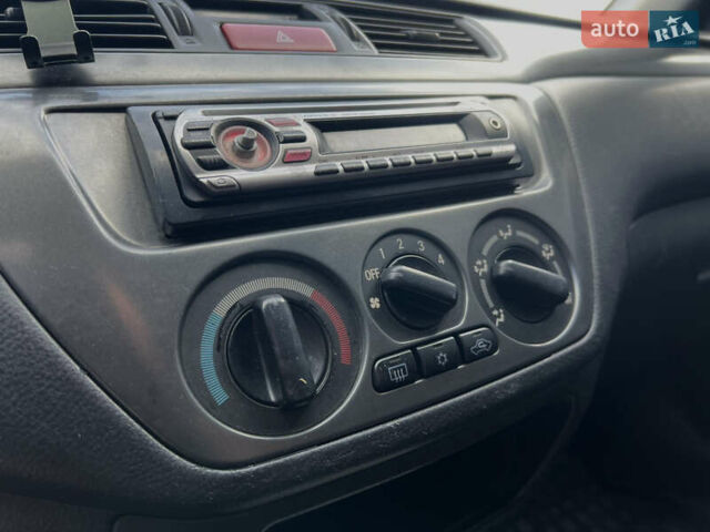 Чорний Міцубісі Lancer, об'ємом двигуна 1.58 л та пробігом 185 тис. км за 3750 $, фото 19 на Automoto.ua