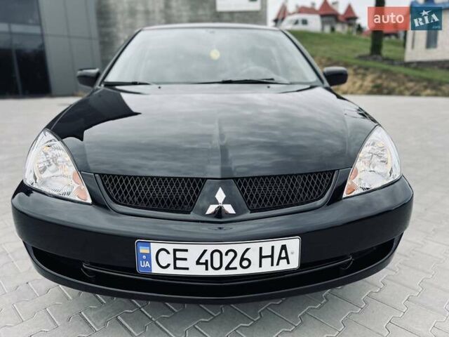 Чорний Міцубісі Lancer, об'ємом двигуна 1.6 л та пробігом 243 тис. км за 4950 $, фото 16 на Automoto.ua