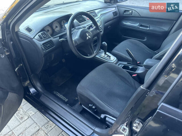 Черный Мицубиси Лансер, объемом двигателя 1.59 л и пробегом 269 тыс. км за 4999 $, фото 11 на Automoto.ua