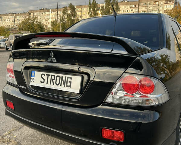Чорний Міцубісі Lancer, об'ємом двигуна 2 л та пробігом 280 тис. км за 4600 $, фото 22 на Automoto.ua