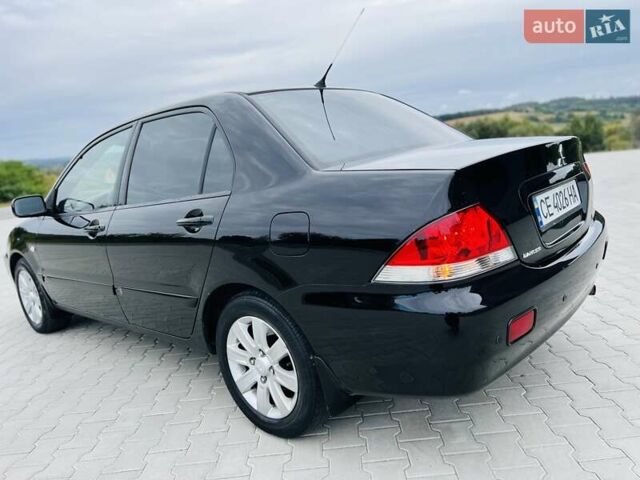 Чорний Міцубісі Lancer, об'ємом двигуна 1.6 л та пробігом 243 тис. км за 4950 $, фото 8 на Automoto.ua