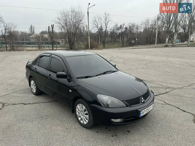 Чорний Міцубісі Lancer, об'ємом двигуна 1.58 л та пробігом 173 тис. км за 5099 $, фото 2 на Automoto.ua