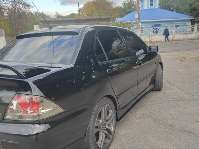 Міцубісі Lancer 2007 у Кам'янське (Дніпродзержинськ) на Automoto.ua Чорний Міцубісі Lancer, об'ємом двигуна 2 л та пробігом 268 тис. км за 5999 $, фото 4 на Automoto.ua