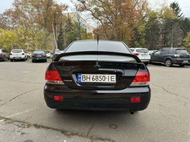 Черный Мицубиси Лансер, объемом двигателя 1.6 л и пробегом 173 тыс. км за 4700 $, фото 3 на Automoto.ua