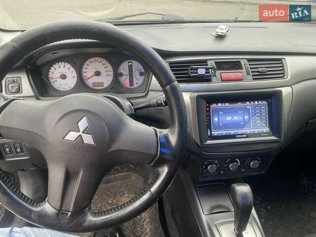 Черный Мицубиси Лансер, объемом двигателя 1.58 л и пробегом 263 тыс. км за 4000 $, фото 13 на Automoto.ua