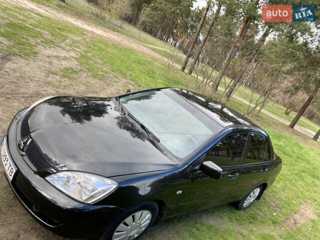 Чорний Міцубісі Lancer, об'ємом двигуна 1.6 л та пробігом 224 тис. км за 4950 $, фото 15 на Automoto.ua