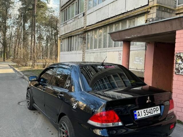 Черный Мицубиси Лансер, объемом двигателя 1.6 л и пробегом 211 тыс. км за 5600 $, фото 1 на Automoto.ua