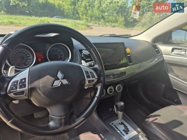 Чорний Міцубісі Lancer, об'ємом двигуна 2 л та пробігом 243 тис. км за 6600 $, фото 15 на Automoto.ua