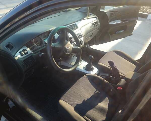Чорний Міцубісі Lancer, об'ємом двигуна 1.59 л та пробігом 180 тис. км за 4999 $, фото 12 на Automoto.ua
