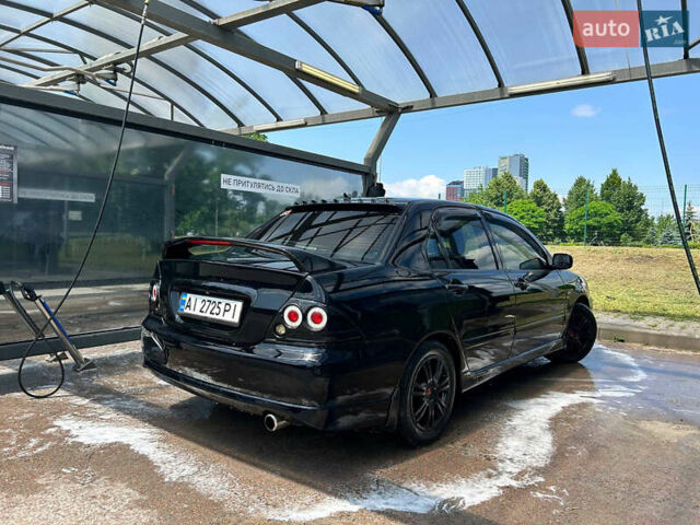 Черный Мицубиси Лансер, объемом двигателя 2 л и пробегом 380 тыс. км за 5000 $, фото 2 на Automoto.ua