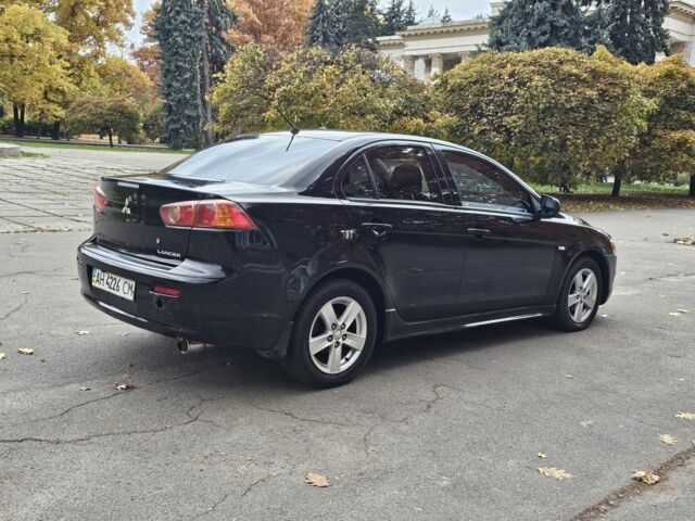 Черный Мицубиси Лансер, объемом двигателя 2 л и пробегом 115 тыс. км за 5000 $, фото 6 на Automoto.ua