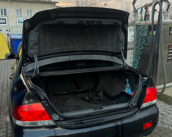 Черный Мицубиси Лансер, объемом двигателя 1.6 л и пробегом 180 тыс. км за 3499 $, фото 8 на Automoto.ua