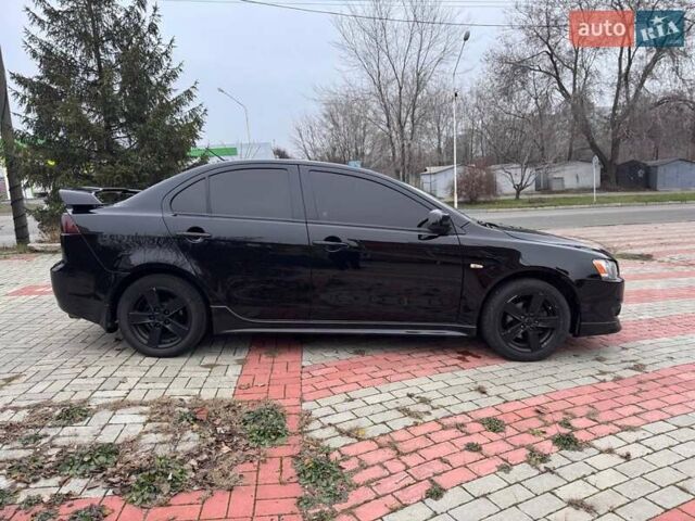 Черный Мицубиси Лансер, объемом двигателя 2 л и пробегом 217 тыс. км за 5500 $, фото 3 на Automoto.ua