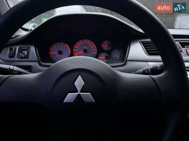 Чорний Міцубісі Lancer, об'ємом двигуна 1.6 л та пробігом 303 тис. км за 4350 $, фото 29 на Automoto.ua