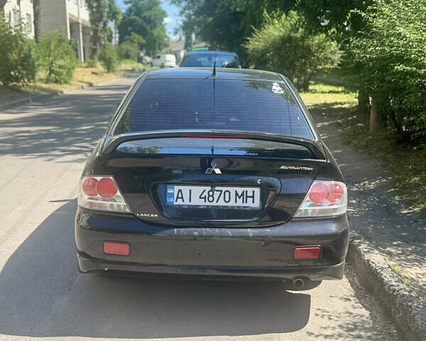 Чорний Міцубісі Lancer, об'ємом двигуна 2 л та пробігом 210 тис. км за 5500 $, фото 47 на Automoto.ua