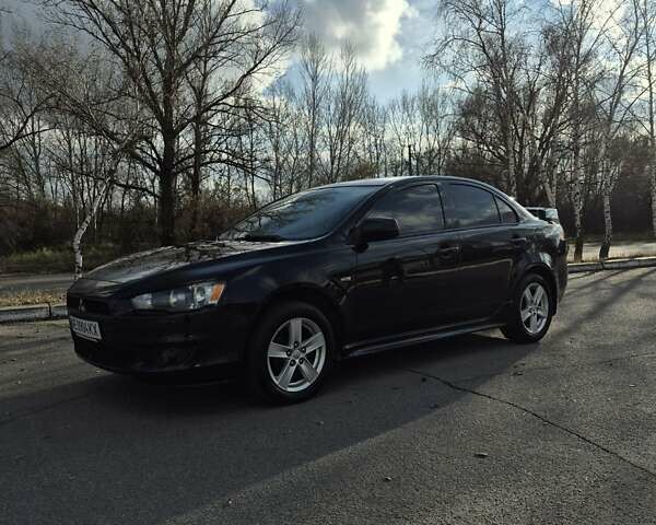 Черный Мицубиси Лансер, объемом двигателя 2 л и пробегом 224 тыс. км за 7000 $, фото 1 на Automoto.ua