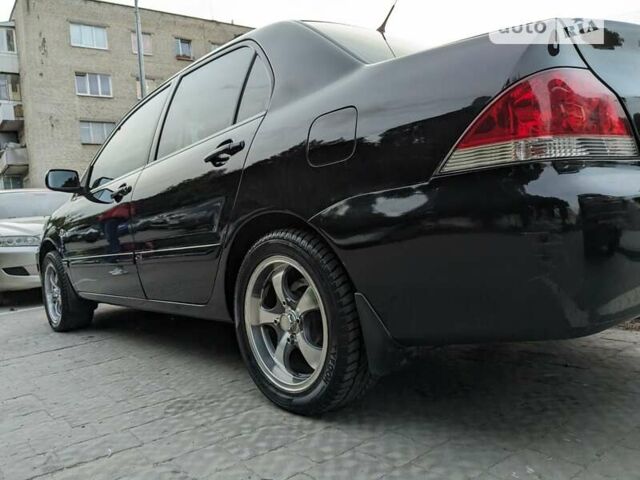 Чорний Міцубісі Lancer, об'ємом двигуна 1.6 л та пробігом 130 тис. км за 5500 $, фото 31 на Automoto.ua