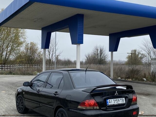Черный Мицубиси Лансер, объемом двигателя 1.6 л и пробегом 263 тыс. км за 2900 $, фото 3 на Automoto.ua