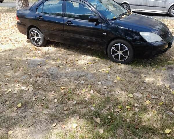 Чорний Міцубісі Lancer, об'ємом двигуна 1.6 л та пробігом 267 тис. км за 4100 $, фото 3 на Automoto.ua