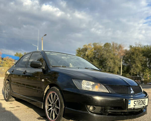 Чорний Міцубісі Lancer, об'ємом двигуна 2 л та пробігом 280 тис. км за 4600 $, фото 4 на Automoto.ua