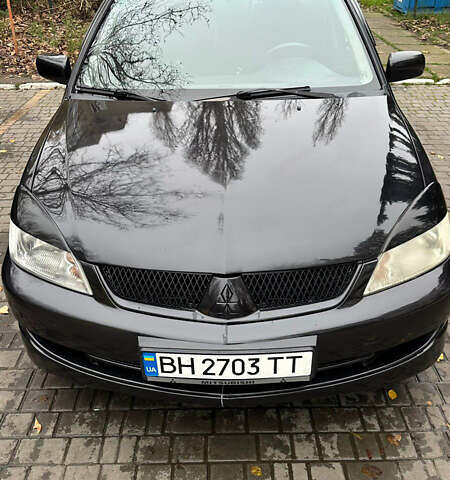 Чорний Міцубісі Lancer, об'ємом двигуна 1.59 л та пробігом 300 тис. км за 3400 $, фото 1 на Automoto.ua