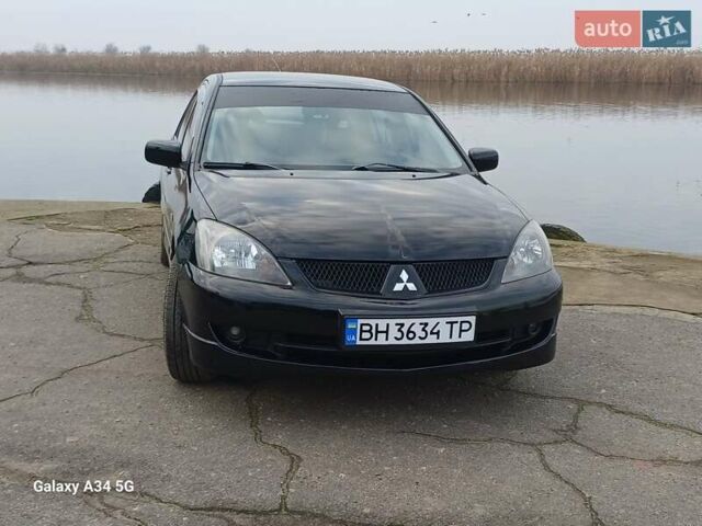 Черный Мицубиси Лансер, объемом двигателя 2 л и пробегом 286 тыс. км за 4000 $, фото 9 на Automoto.ua