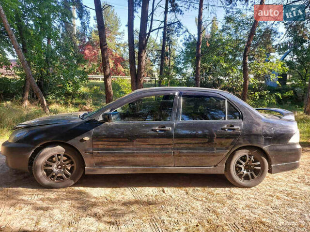 Чорний Міцубісі Lancer, об'ємом двигуна 2 л та пробігом 290 тис. км за 3300 $, фото 6 на Automoto.ua
