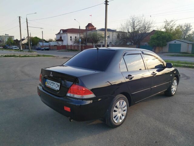 Черный Мицубиси Лансер, объемом двигателя 1.6 л и пробегом 32 тыс. км за 9000 $, фото 15 на Automoto.ua