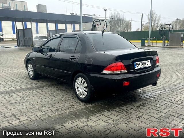 Чорний Міцубісі Lancer, об'ємом двигуна 1.6 л та пробігом 248 тис. км за 3950 $, фото 2 на Automoto.ua