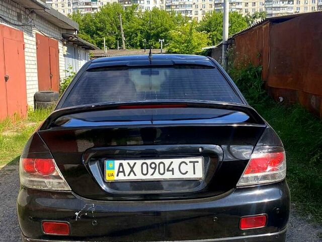 Чорний Міцубісі Lancer, об'ємом двигуна 2 л та пробігом 220 тис. км за 5300 $, фото 2 на Automoto.ua