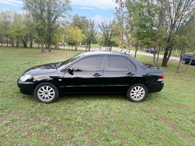 Чорний Міцубісі Lancer, об'ємом двигуна 1.6 л та пробігом 280 тис. км за 4088 $, фото 8 на Automoto.ua