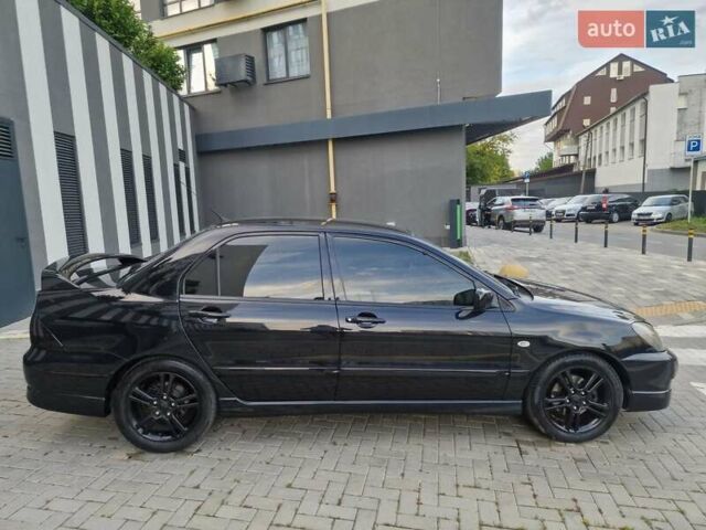 Чорний Міцубісі Lancer, об'ємом двигуна 2 л та пробігом 272 тис. км за 4750 $, фото 8 на Automoto.ua