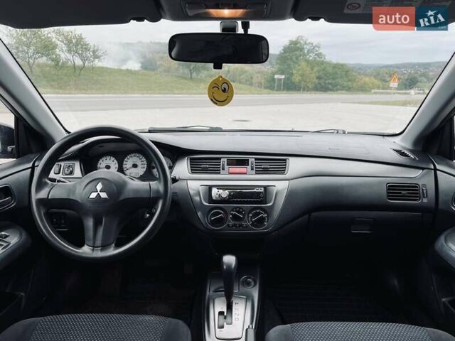 Чорний Міцубісі Lancer, об'ємом двигуна 1.6 л та пробігом 243 тис. км за 4950 $, фото 47 на Automoto.ua