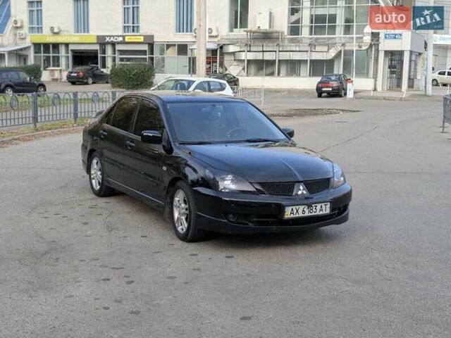 Чорний Міцубісі Lancer, об'ємом двигуна 2 л та пробігом 152 тис. км за 5500 $, фото 6 на Automoto.ua