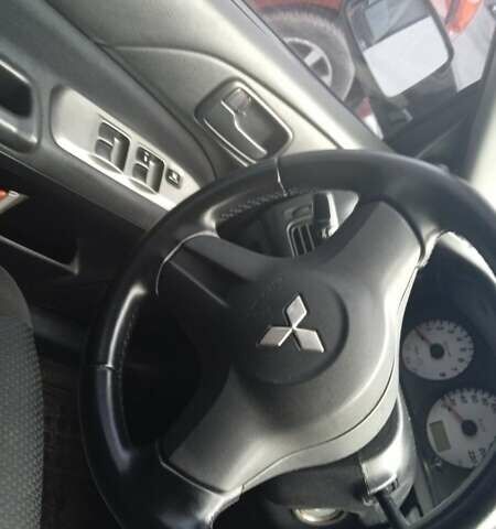 Черный Мицубиси Лансер, объемом двигателя 1.6 л и пробегом 223 тыс. км за 4300 $, фото 1 на Automoto.ua