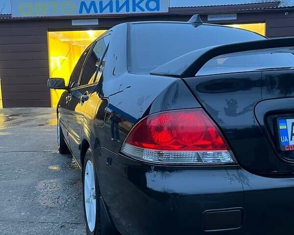 Черный Мицубиси Лансер, объемом двигателя 1.6 л и пробегом 249 тыс. км за 5000 $, фото 8 на Automoto.ua