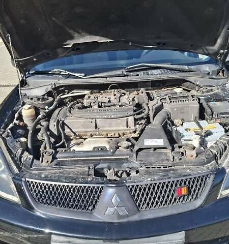 Чорний Міцубісі Lancer, об'ємом двигуна 2 л та пробігом 174 тис. км за 4800 $, фото 4 на Automoto.ua