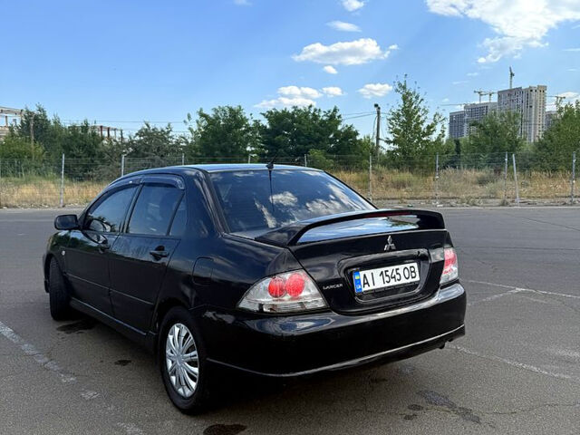 Черный Мицубиси Лансер, объемом двигателя 2 л и пробегом 250 тыс. км за 3850 $, фото 7 на Automoto.ua
