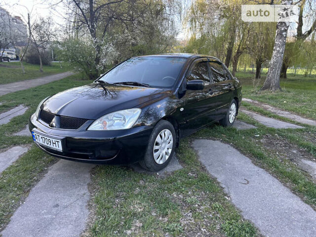 Чорний Міцубісі Lancer, об'ємом двигуна 1.58 л та пробігом 161 тис. км за 5300 $, фото 3 на Automoto.ua