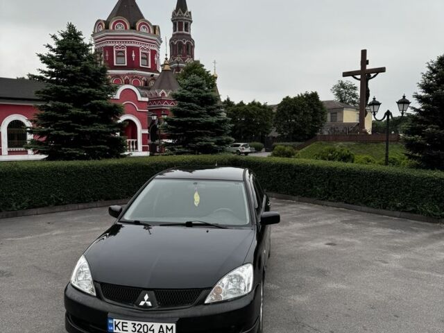 Чорний Міцубісі Lancer, об'ємом двигуна 2 л та пробігом 222 тис. км за 4900 $, фото 6 на Automoto.ua